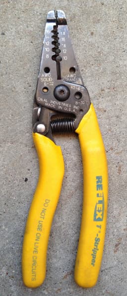 Reference image: IDEAL Reflex T-Stripper shown (same family): a yellow-handled IDEAL Reflex wire stripper. IDEAL Reflex T-Stripper shown (same family); Similar model shown.